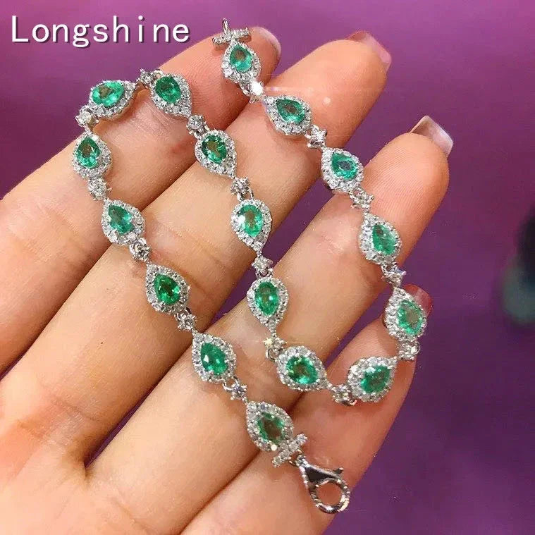 18K gold emerald diamond bracelet with pear-shaped emeralds and sparkling diamonds on a delicate chain